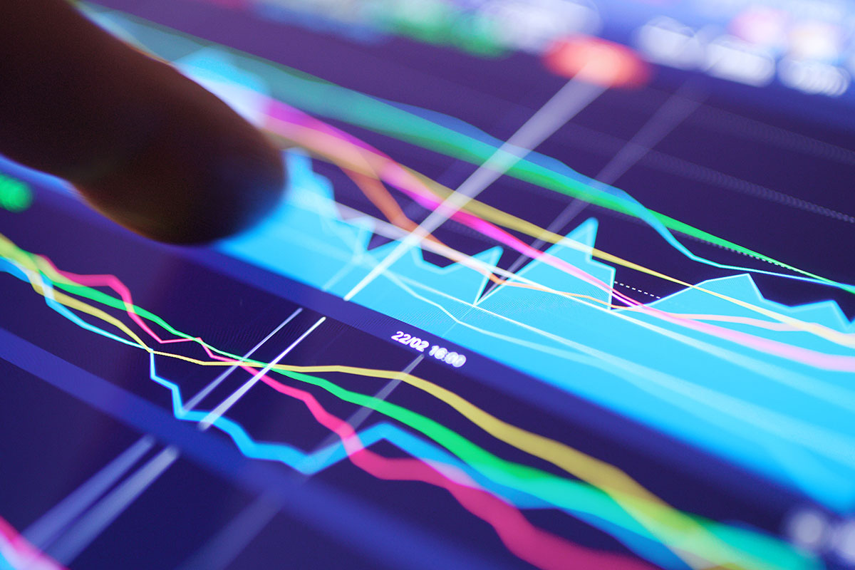 working-on-digital-tablet-with-stock-market-graph-2023-11-27-05-04-23-utc